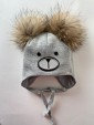 Шапка трехслойная с завязками и помпонами из енота.Цвет: серый